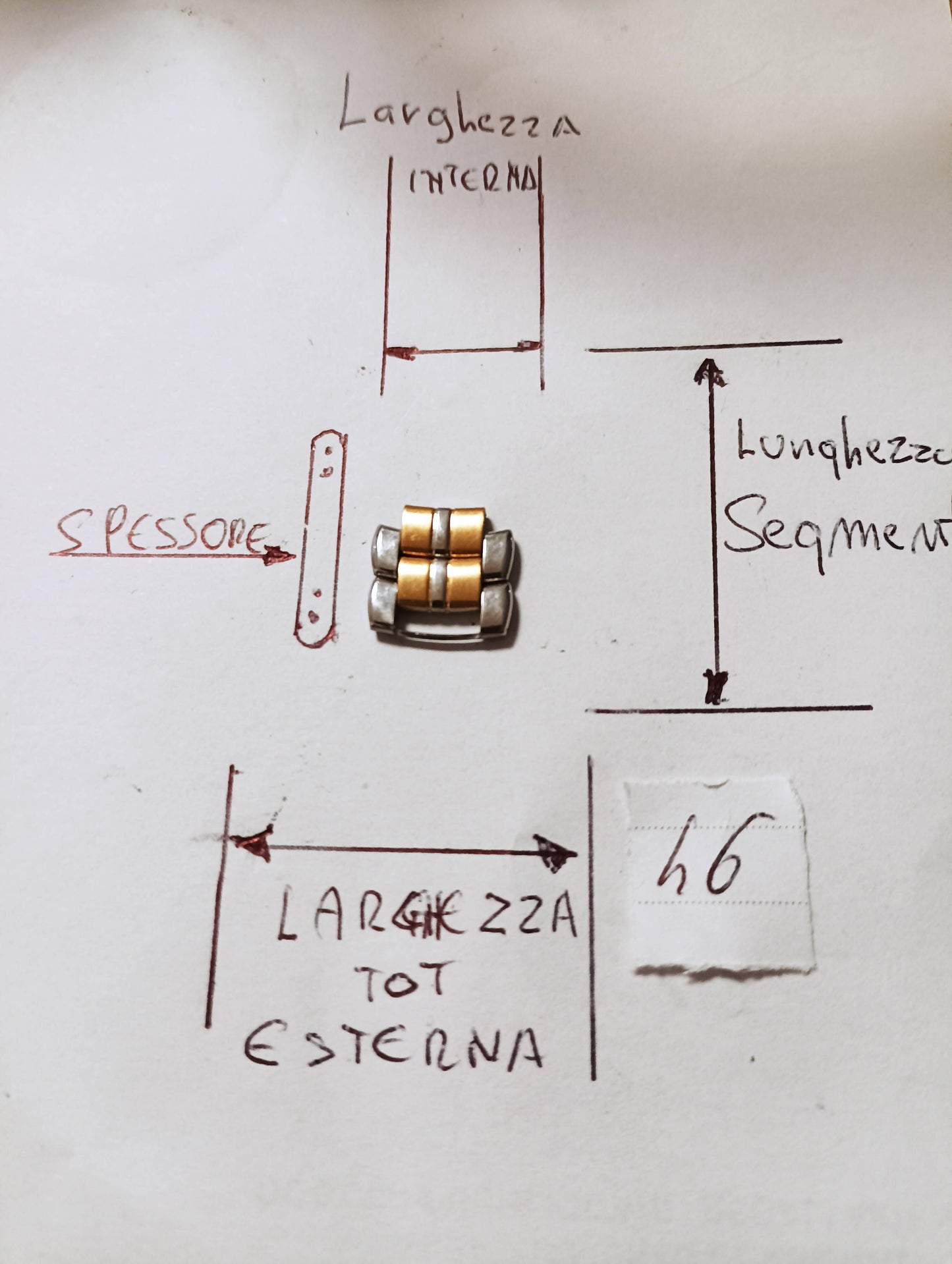 Maglia aggiuntiva per bracciale color acciaio e oro delle dimensioni di 12,98m.m. esterna massima 7,42 m.m. interna, spessore 2,16 m.m. lunghezza segmento 4,9m.m.