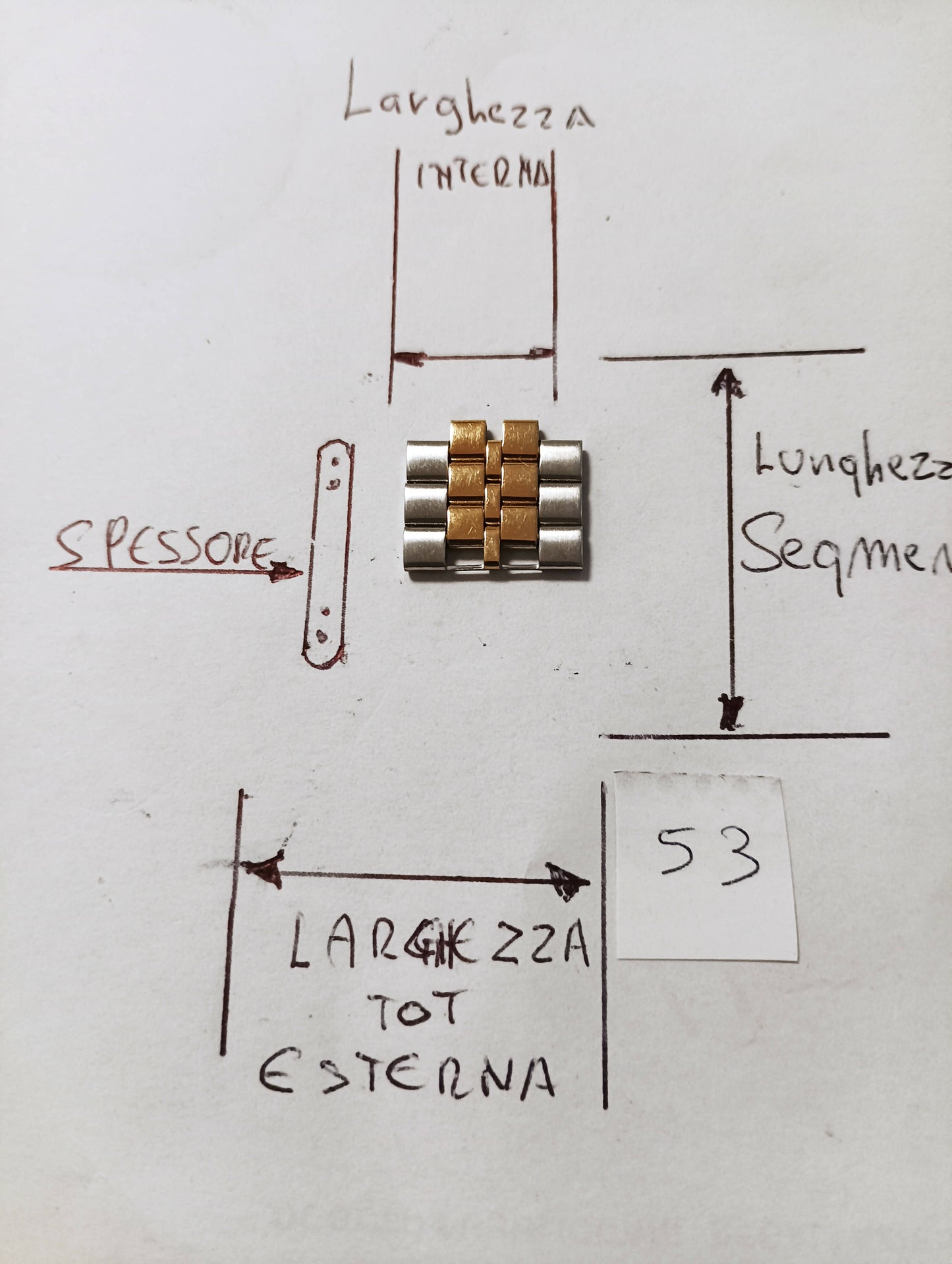 Maglia aggiuntiva per bracciale color acciaio e oro delle dimensioni dilarghezza. massima esterna 15,96 m.m. interna .