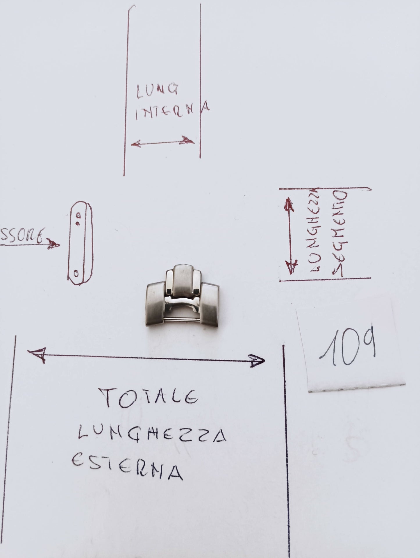 Maglia aggiuntiva per bracciale color acciaio e cromo, dalle dimensioni di 16,04 m.m. larghezza esterna e di 7,76 m.m. larghezza interna, spessore 3,25m.m. lunghezza segmento 13,69 m.m.